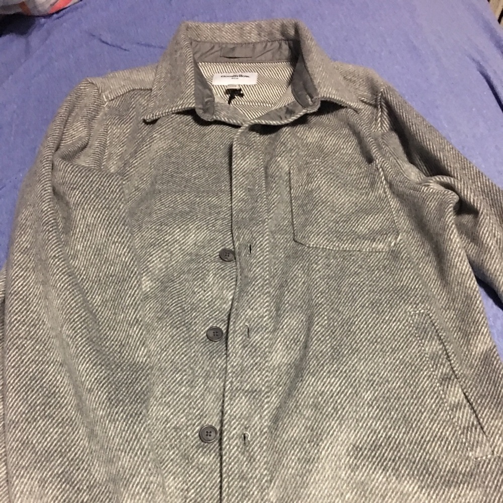A gray woven button down jacket